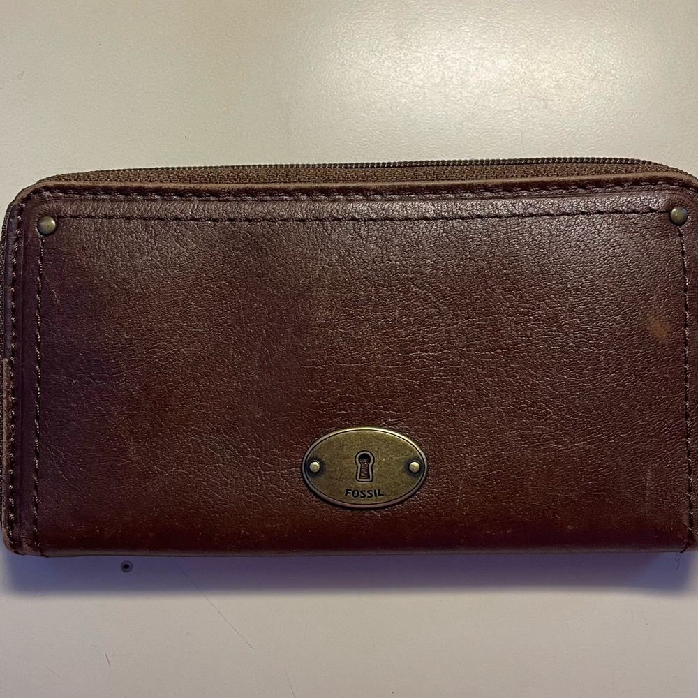 Brown zip around fossil wallet.